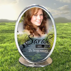 Stainless steel inlaid cremation urn with polished finish and engraved detailing, designed for secure ash storage and elegant memorial presentation.